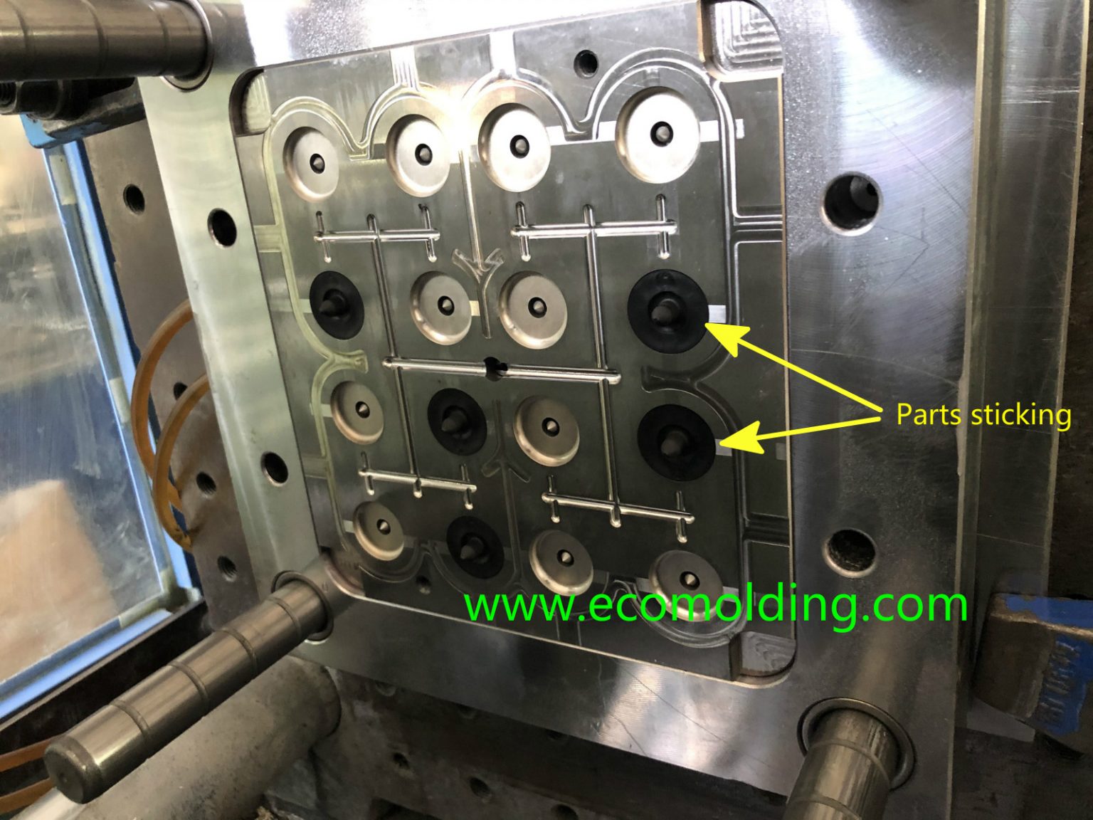 What causes parts sticking or sprue sticking during injection molding?